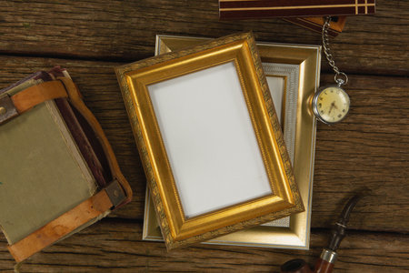 Photo frame, clock and bag on wooden table, Close-upの写真素材