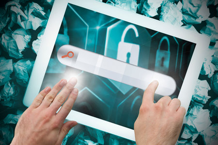Hands touching search bar on tablet screen on crumpled up paper