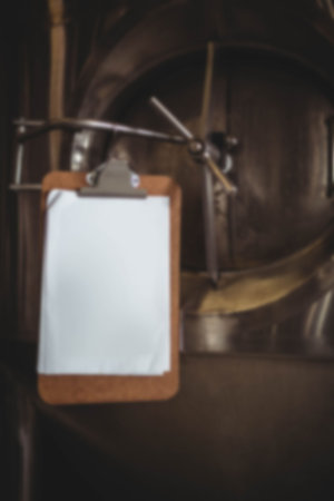 Writing pad on manufacturing machinery at factory