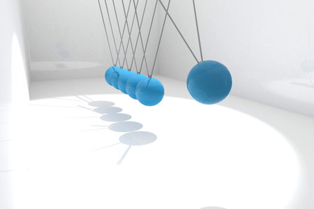 Showing close-up Newton's cradle hanging blue spheres on wires in white space casting long shadows....