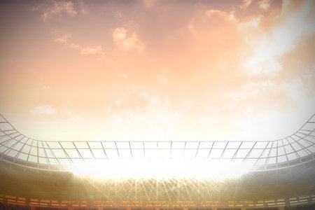 Digitally generated large football stadium with spotlights under pink skyの写真素材