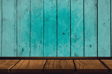Wooden tabletop is featuring brown planks under weathered turquoise wall in flat design, copy space....