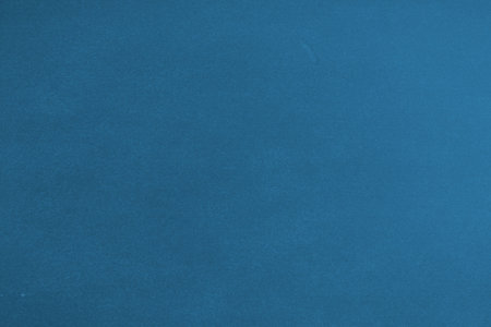 Blue textured surface is being displayed in flat illustration, showcasing subtle tonal shifts....