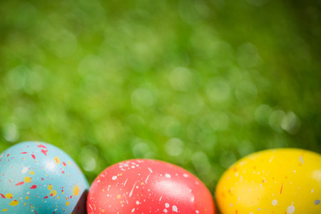 Colorful Easter eggs on grass in yard
