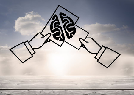 Digitally generated image of hands holding a sketch of brain against the skyの写真素材