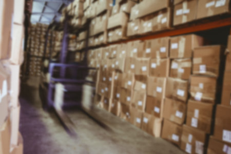 Blurred motion of forklift in warehouse
