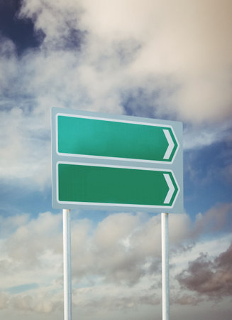 Green sign post against cloudy skyの写真素材
