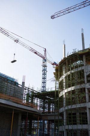 Crane and building construction site on a sunny day
