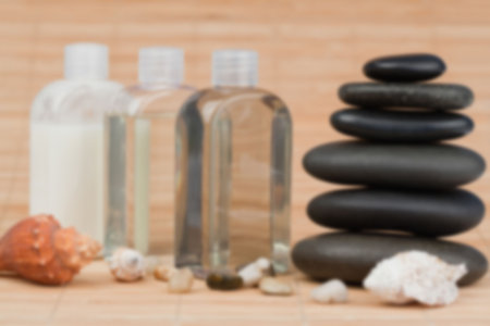 Oils with pebbles on table at spaの写真素材