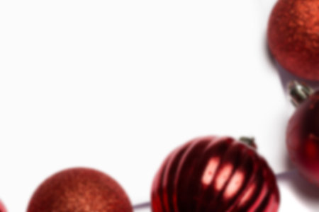 Red christmas baubles on white pageの写真素材