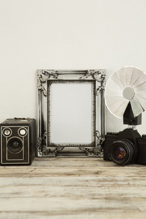 Photo frame, speaker and camera on table, Close-upの写真素材