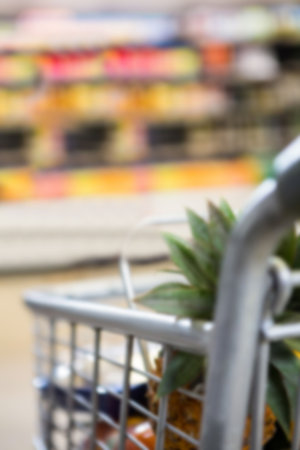 Close-up of pineapple in shopping cart at supermarketの写真素材