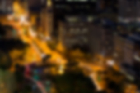Defocused image of illuminated cityscape at night