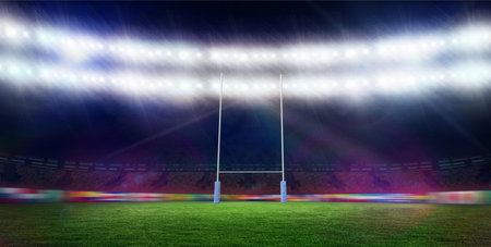 Rugby goalposts are standing on green turf under floodlights in flat design with blue padding. Sports, stadium, illumination, athletic, competition, outdoor, energyの写真素材
