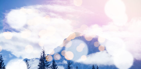 Scenic view of snow covered mountains with bokeh in foreground