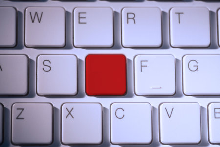Digital composite of Red key on keyboardの写真素材