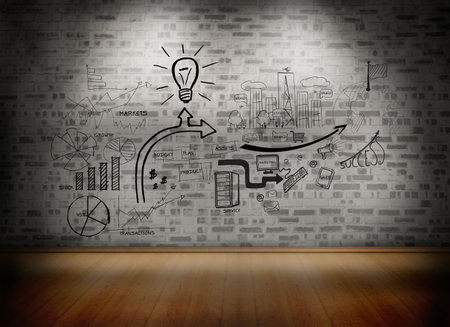 Black white graphics over brick lined wallの写真素材