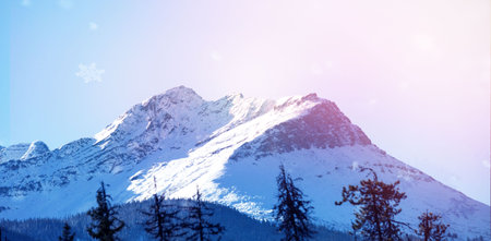Low angle view of snowcapped mountain against sky