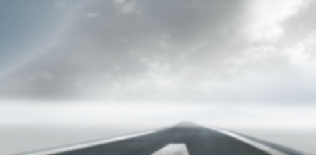 View road leading against cloudsの写真素材