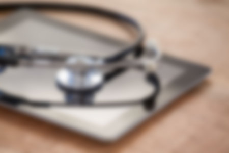 Blurry stethoscope on digital tablet