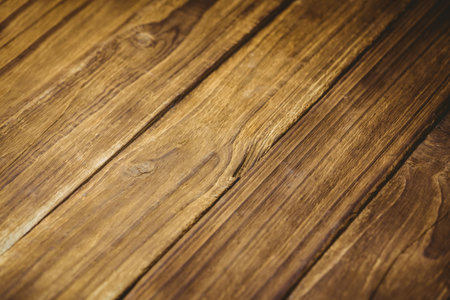 Brown wooden planks are aligning diagonally in flat design, showing natural grain and knots....