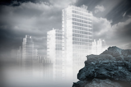 Digitally generated large rock overlooking outline of cityの写真素材