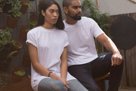 couple in white t-shirt sitting