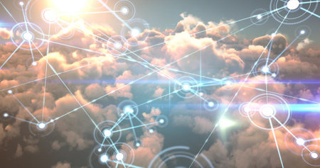 Digital composite image of interface connecting lines and dots over orange cloudsの写真素材