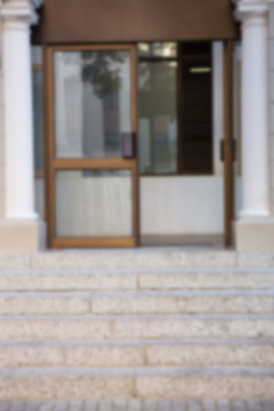 Steps leading towards open door of buildingの写真素材