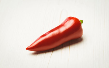 Red hot pepper on wooden table