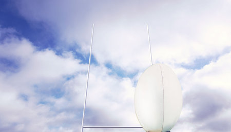 Rugby ball in front of postsの写真素材