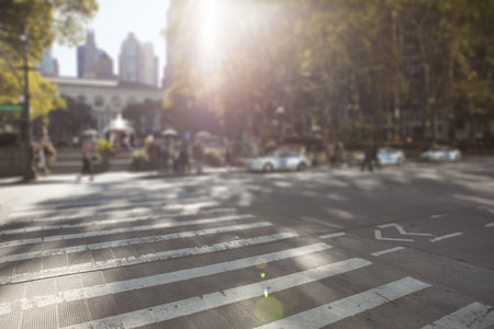 Wide pedestrian crosswalk is spanning urban street in flat design, with fountain and cars....