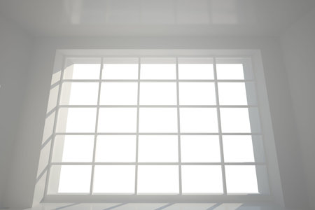 White wall covered with windowsの写真素材