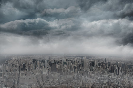Flat design panoramic city skyline is showing dense high-rise towers under swirling storm clouds. Urban, metropolis, architecture, skyline, weather, dramatic, monochromeの写真素材