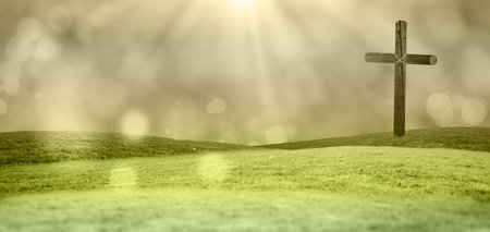 Solitary wooden cross is standing on green rolling hills in flat design with soft sun rays. Landscape, serenity, natural, spiritual, emblem, outdoor, tranquilの写真素材