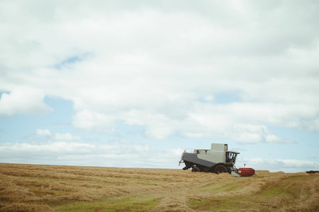 View of a harvester on a fieldの写真素材