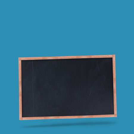 Blank chalkboard is hovering in flat design on teal backdrop, with wooden frame and drop shadow. Minimalist, modern, educational, clean, professional, dynamic, versatileの写真素材