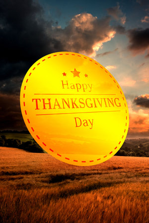 Digitally composite image of Happy Thanksgiving text against cloudy skyの写真素材