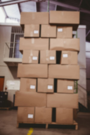 Cardboard boxes arranged in storage room