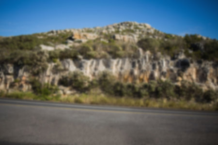 Woman posing in front of camera against mountainの写真素材
