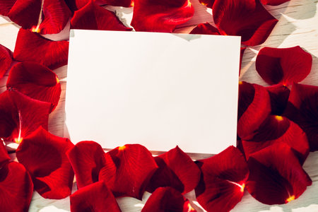 Card with red rose petals and copy spaceの写真素材