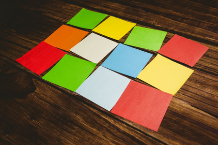High angle view of multi colored papers on wooden floor