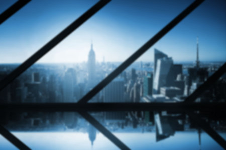 Computer graphic image of cityscape against blue sky seen through metal grate at building