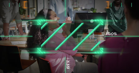 Clapping Hispanic woman wearing pink sweater at office desk, with keyboard and green graphics....