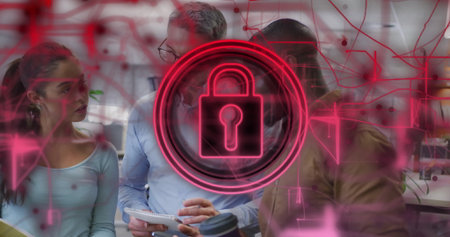 Reviewing team using notepad in open plan office, with neon padlock hologram and network circuitry....
