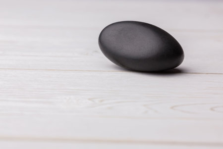 Close-up of black stone on table