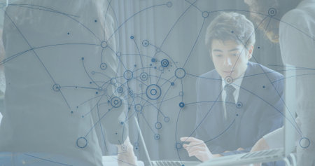Collaborating man and female colleagues analyzing network diagram on laptop in boardroom, data flow....