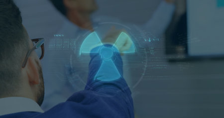 Pointing senior wearing suit manipulating floating radiation hazard symbol in boardroom, copy space. Augmentedreality, digitalinterface, corporate, innovation, futuristic, collaboration, dataanalyticsの写真素材