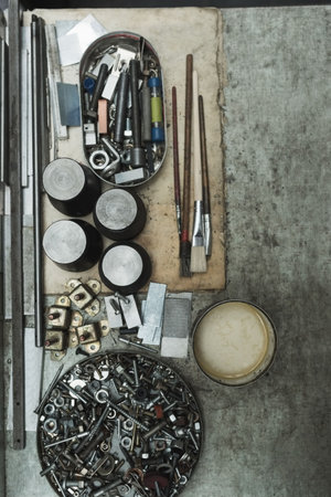 Overhead view of tools on table in factoryの写真素材