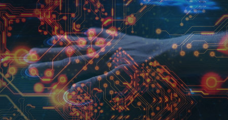 Typing IT professional hands controlling keyboard at dimly lit desk, glowing circuit nodes overlay. Technology, cybersecurity, digital, connectivity, networking, innovation, circuitryの写真素材